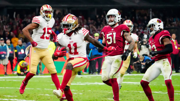 Nov 21, 2022; Mexico City, MEXICO; San Francisco 49ers wide receiver Brandon Aiyuk (11) celebrates scoring a touchdown following his reception against the Arizona Cardinals during the second half at Estadio Azteca.